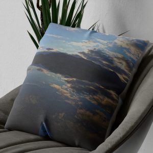 Loch Lomond mirror reflection cushion on an armchair, close view