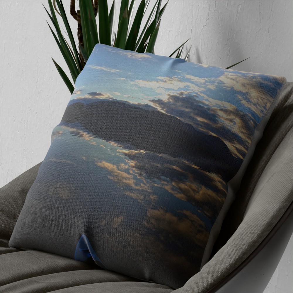 Loch Lomond mirror reflection cushion on an armchair, close view