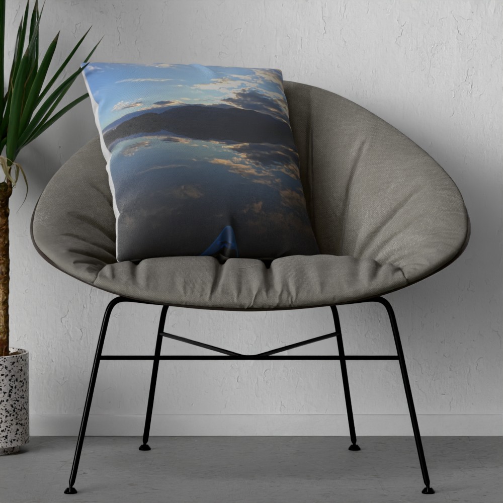 Loch Lomond mirror reflection cushion on an armchair