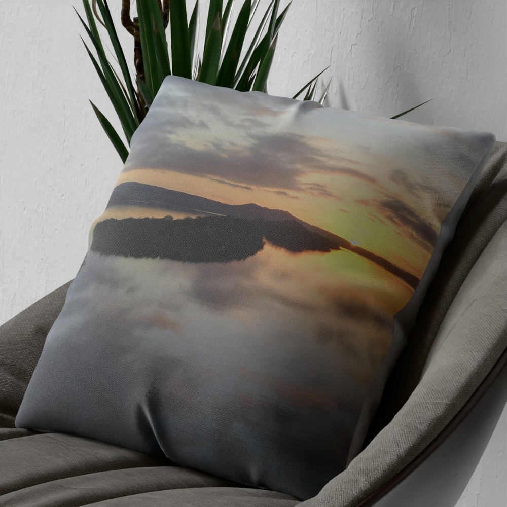 Loch Lomond sunset cushion on an armchair, close view